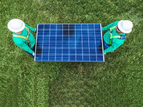workers-holding-solar-panel